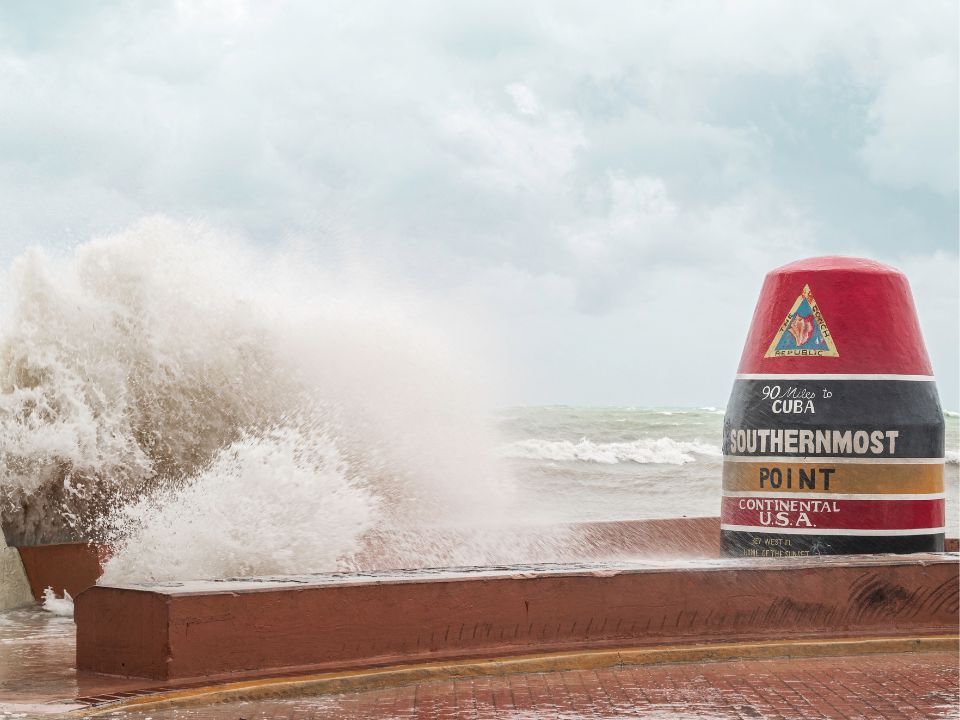 Southernmost Point marker in Key West, during a severe storm