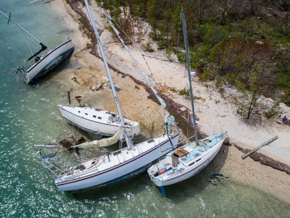 Aerial drone shot of sail boats washed ashore on Wisteria Island Key West Florida after Hurricane Irma