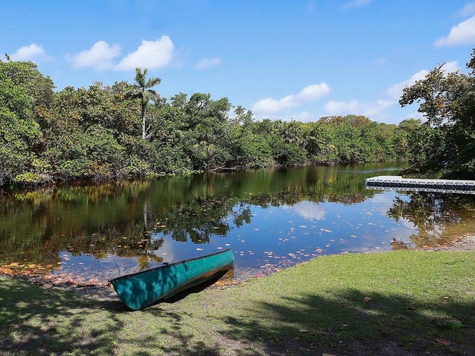 Canoe at the waters edge at Hugh Taylor Birch State Park in Fort Lauderdale, Florida, USA