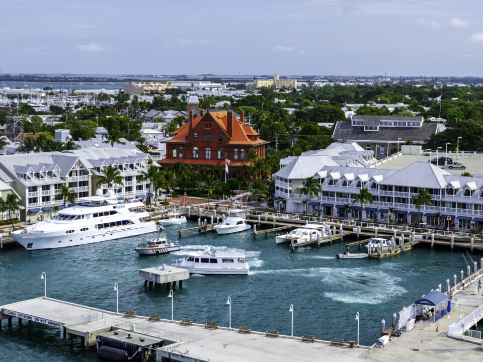 Aerial view of the Key West harbor, marina and the red-brick Custom House with Old Town behind