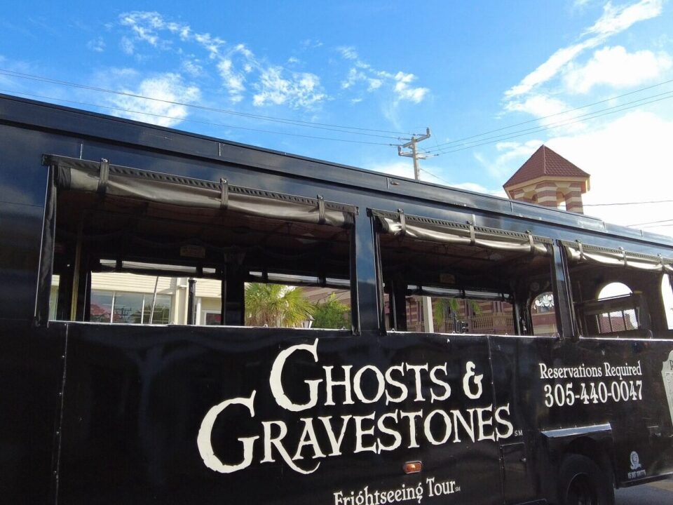 Black Ghosts and Gravestones Frightseeing Tour trolley parked on a Key West street