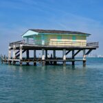 Cormorants resting on Bay Chateau, one of seven remaining stilt houses built over grass flats of Biscayne National Park.