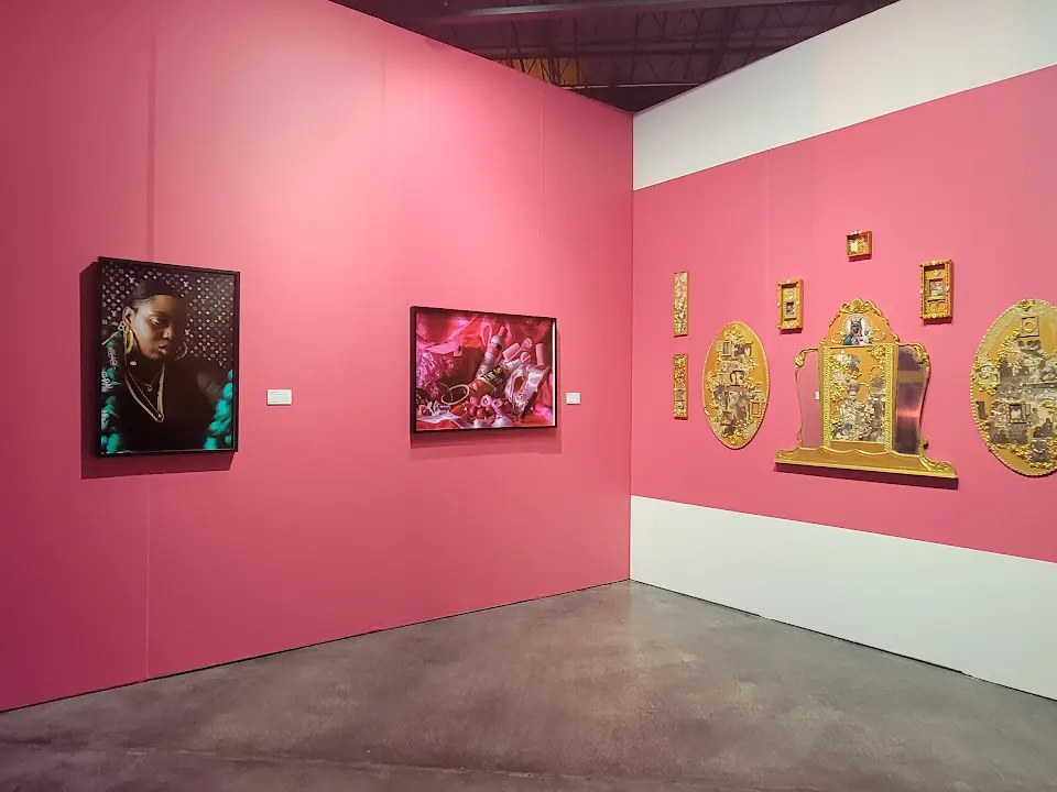 A pink-walled gallery interior in Wynwood showing contemporary art during Miami Art Week